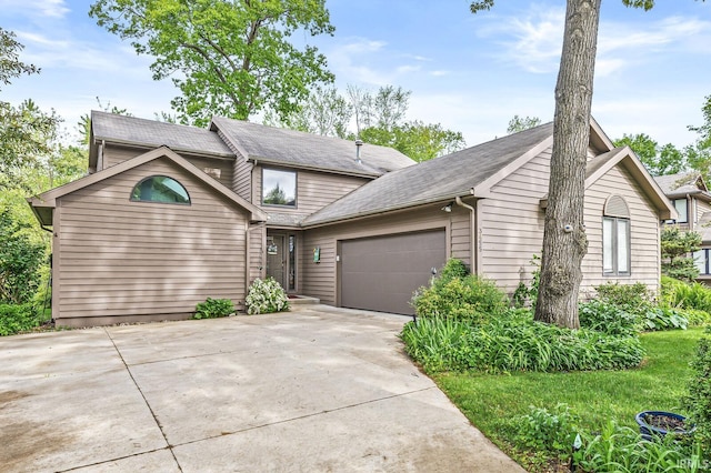 3455 Bridgetown Rd, Bristol, IN 46507 - view of front of home featuring an attached garage, concrete driveway, and roof with shingles