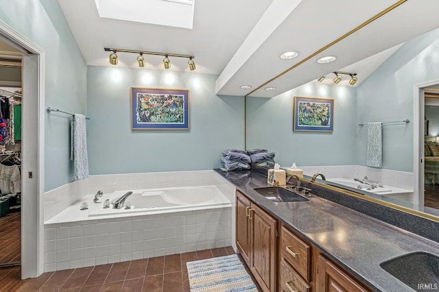 3455 Bridgetown Rd, Bristol, IN 46507 - bathroom featuring track lighting, a garden tub, and double vanity