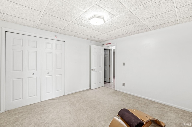 3455 Bridgetown Rd, Bristol, IN 46507 - unfurnished bedroom with light carpet, a closet, a paneled ceiling, and baseboards