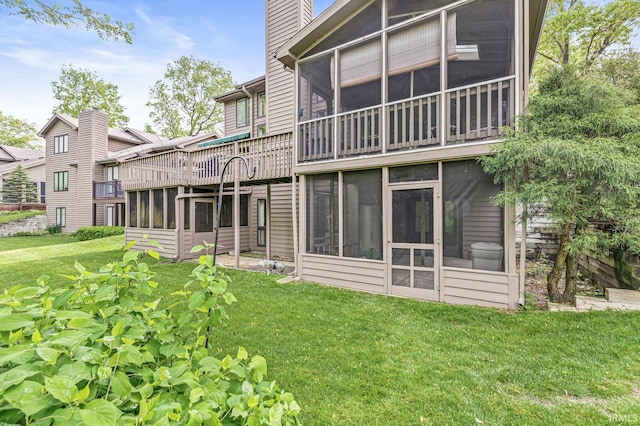 3455 Bridgetown Rd, Bristol, IN 46507 - rear view of property with a sunroom, a lawn, and a chimney