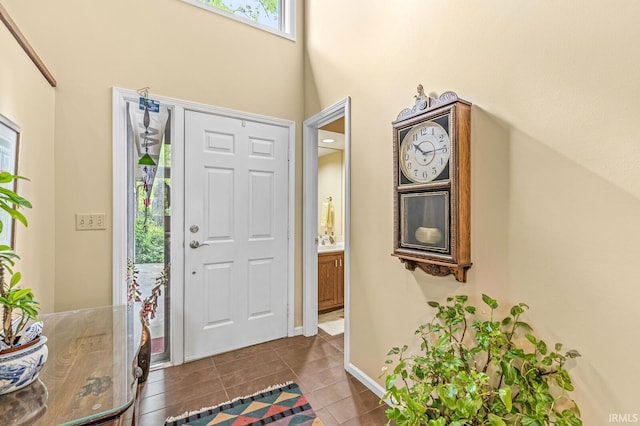 3455 Bridgetown Rd, Bristol, IN 46507 - foyer entrance with a towering ceiling, dark tile patterned floors, and baseboards