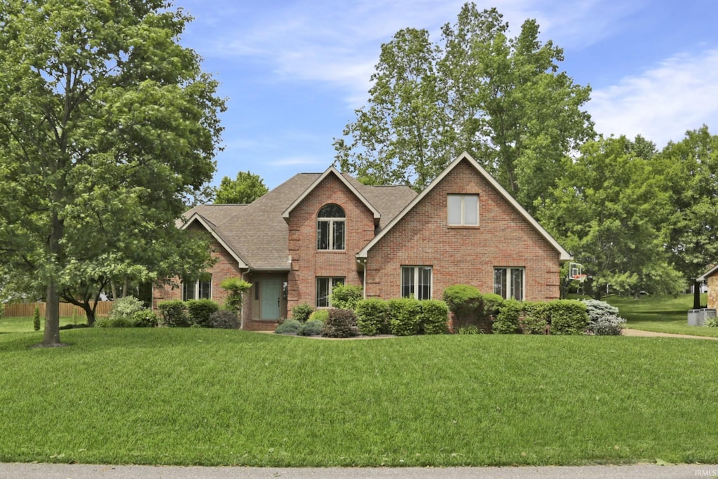 10188 Byron Ct, Newburgh, IN 47630 - traditional-style home featuring brick siding, a front yard, and a shingled roof