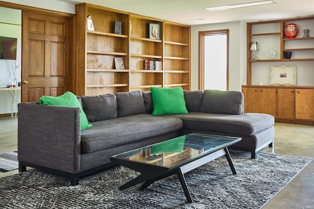 living area featuring finished concrete flooring