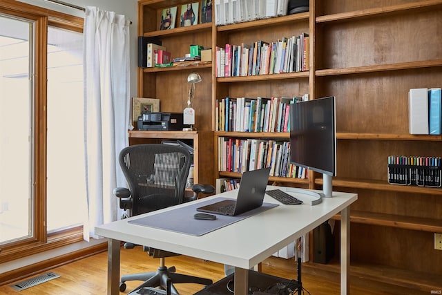 office area with wood finished floors