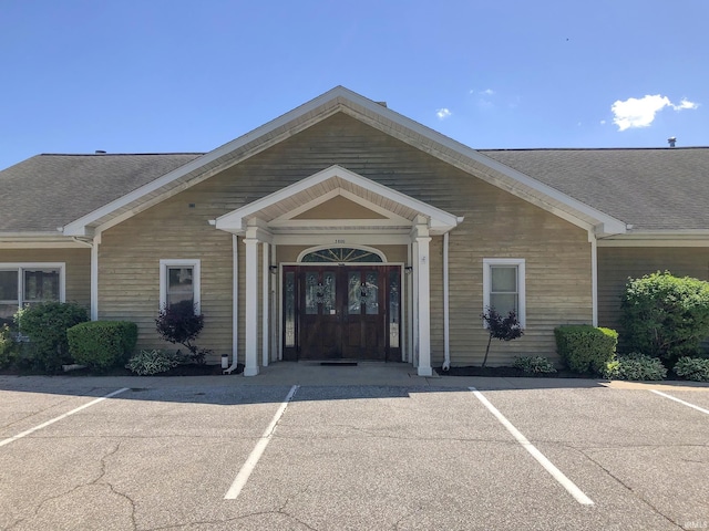 1600 Blue Heron Way S, Bend, IN 46628 - view of exterior entry featuring uncovered parking and roof with shingles