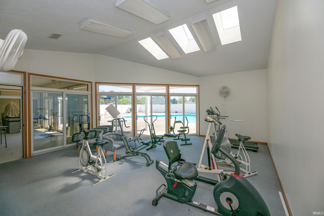 1600 Blue Heron Way S, Bend, IN 46628 - exercise room featuring a skylight, vaulted ceiling, and baseboards