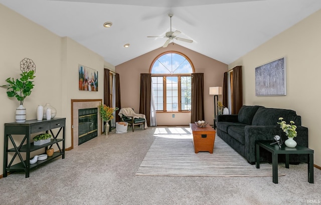 1600 Blue Heron Way S, Bend, IN 46628 - carpeted living room featuring a ceiling fan, a tile fireplace, and vaulted ceiling