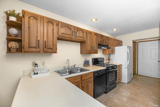 1600 Blue Heron Way S, Bend, IN 46628 - kitchen with black appliances, under cabinet range hood, a sink, light countertops, and brown cabinetry