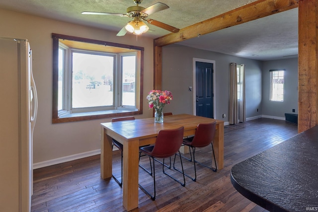 120 W Williams St, Chandler, IN 47610 - dining room featuring baseboards, hardwood / wood-style flooring, a ceiling fan, a textured ceiling, and beamed ceiling