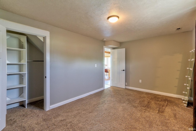 120 W Williams St, Chandler, IN 47610 - unfurnished bedroom featuring carpet flooring, a textured ceiling, baseboards, and a closet