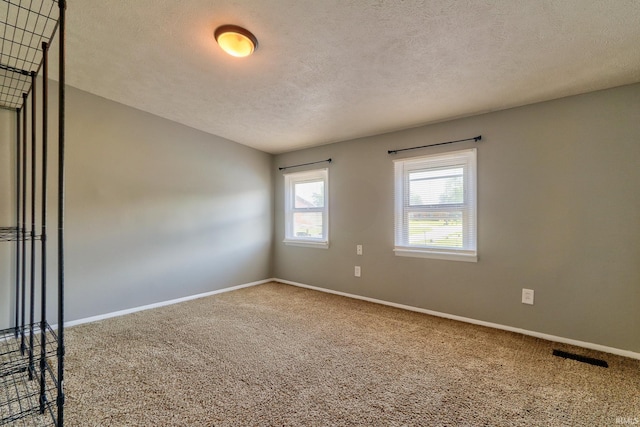120 W Williams St, Chandler, IN 47610 - unfurnished room featuring carpet, a textured ceiling, and baseboards