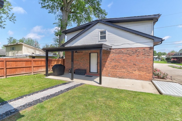 120 W Williams St, Chandler, IN 47610 - rear view of property with a patio and brick siding