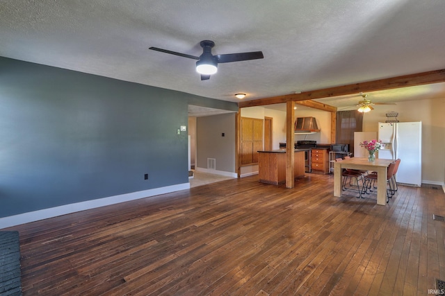 120 W Williams St, Chandler, IN 47610 - kitchen featuring stainless steel appliances, ceiling fan, dark countertops, baseboards, and dark wood finished floors