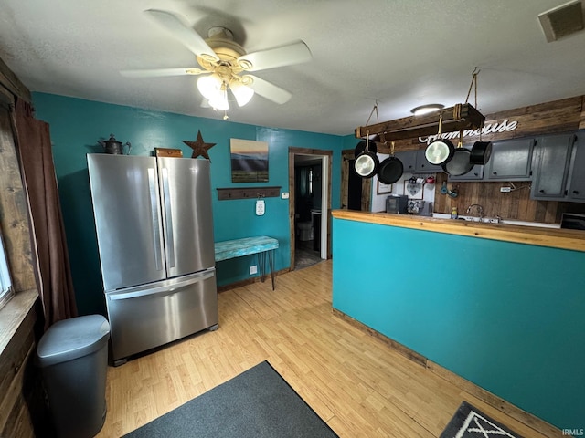 6008 N 600 E, Rochester, IN 46975 - kitchen with freestanding refrigerator, wood counters, light wood finished floors, and ceiling fan