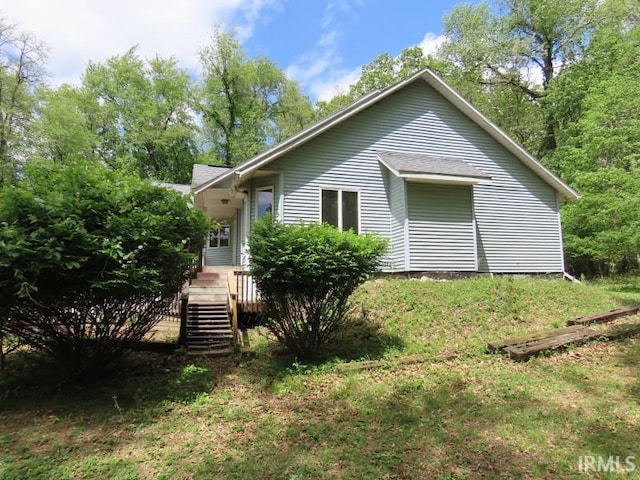 rear view of house featuring stairway