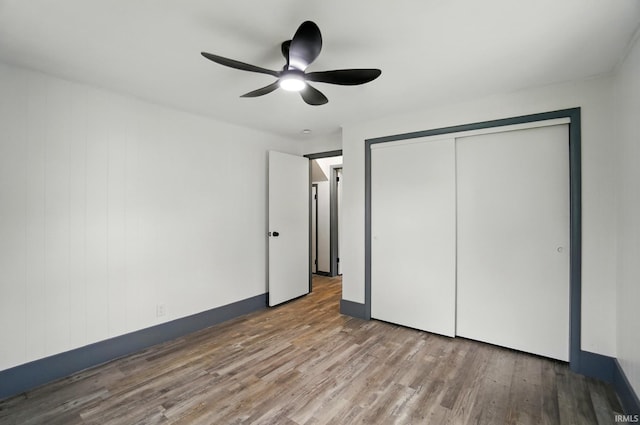 3560 Sandpoint Rd, Fort Wayne, IN 46809 - unfurnished bedroom with wood finished floors, a closet, and ceiling fan