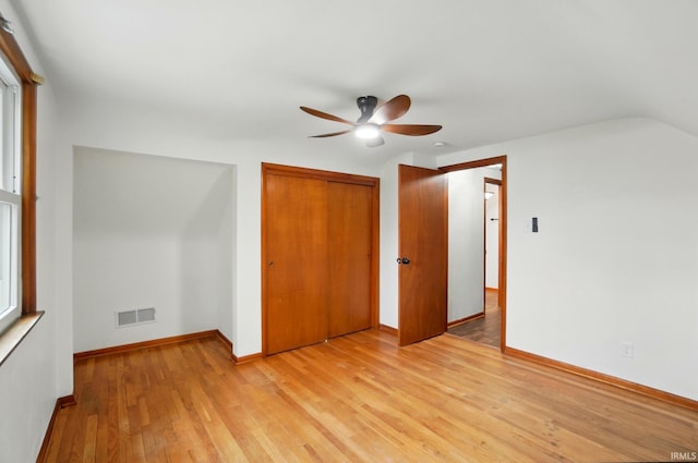 3560 Sandpoint Rd, Fort Wayne, IN 46809 - unfurnished bedroom featuring light wood-style flooring, baseboards, a closet, ceiling fan, and vaulted ceiling