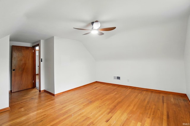 3560 Sandpoint Rd, Fort Wayne, IN 46809 - bonus room featuring a ceiling fan, baseboards, light wood-style floors, and vaulted ceiling