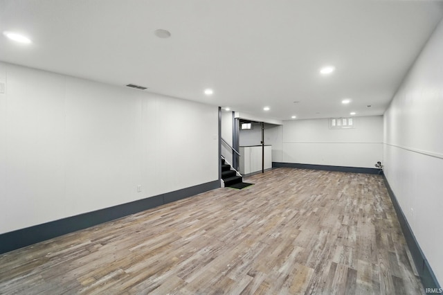 3560 Sandpoint Rd, Fort Wayne, IN 46809 - finished basement with wood finished floors, stairway, baseboards, and recessed lighting
