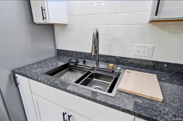 3560 Sandpoint Rd, Fort Wayne, IN 46809 - kitchen featuring a sink, decorative backsplash, and white cabinets