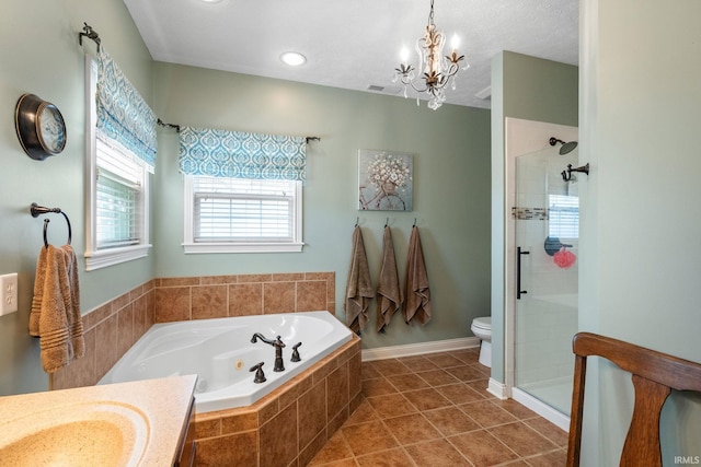 3934 Rushgrove Dr, Lafayette, IN 47909 - full bathroom featuring a shower stall, a chandelier, a jetted tub, toilet, and tile patterned flooring