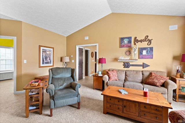 3934 Rushgrove Dr, Lafayette, IN 47909 - living area featuring light carpet, lofted ceiling, radiator, and baseboards