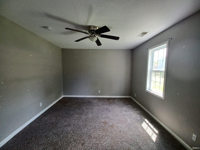 4020 N Fourth Ave, Evansville, IN 47711 - unfurnished room featuring carpet floors, a ceiling fan, baseboards, a textured ceiling, and a smoke detector