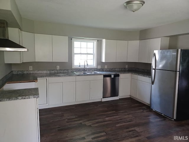 4020 N Fourth Ave, Evansville, IN 47711 - kitchen with stainless steel appliances, wall chimney exhaust hood, a sink, dark wood-style flooring, and white cabinets