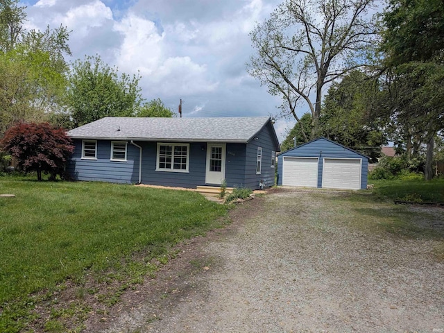 single story home with a detached garage, an outdoor structure, a shingled roof, and a front yard