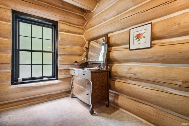 7428 E 400 N Rd, Rolling Prairie, IN 46371 - detailed view of carpet floors and log walls