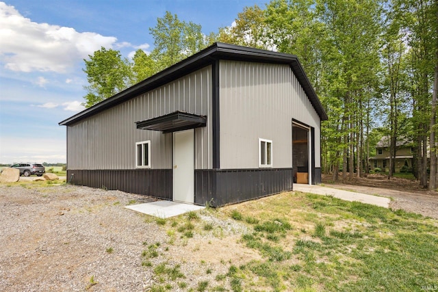 7428 E 400 N Rd, Rolling Prairie, IN 46371 - view of side of property featuring a detached garage and an outdoor structure