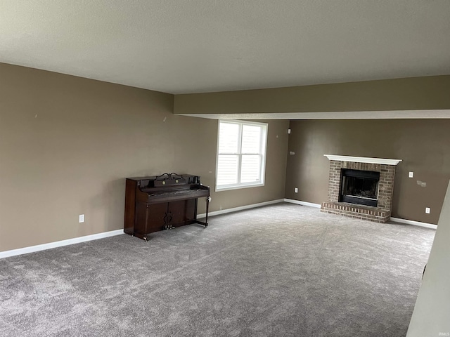 201 Riley Dr, Fort Wayne, IN 46825 - unfurnished living room with carpet, a brick fireplace, baseboards, and a textured ceiling
