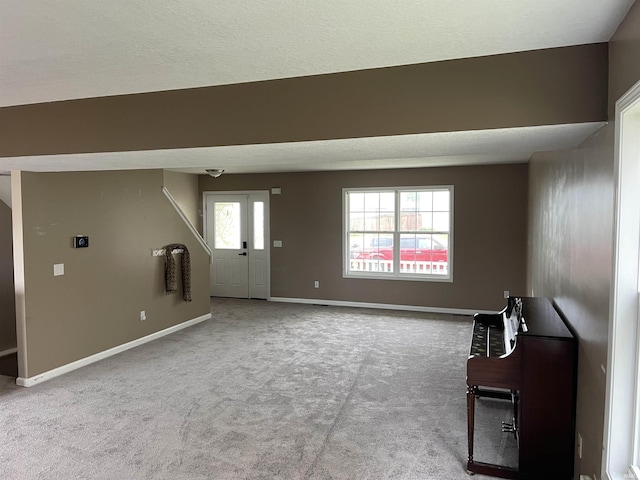 201 Riley Dr, Fort Wayne, IN 46825 - unfurnished living room with carpet flooring and baseboards