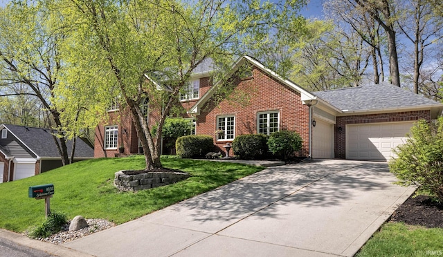 9838 Gulfstream Ct, Fishers, IN 46037 - view of front of home featuring brick siding, a garage, a front lawn, driveway, and roof with shingles