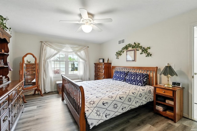 bedroom with wood finished floors and ceiling fan
