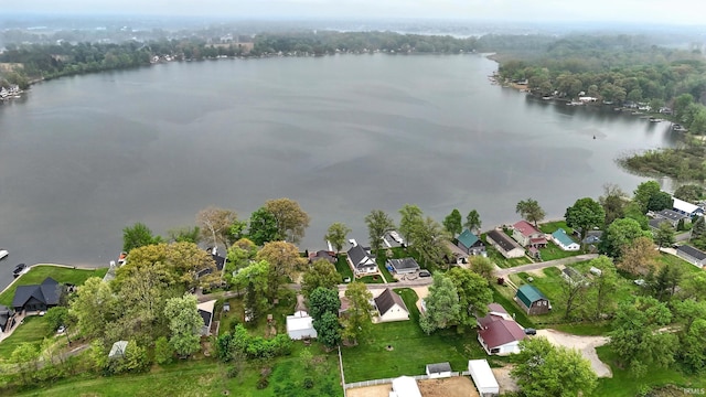view of property location featuring a large body of water and nearby suburban area