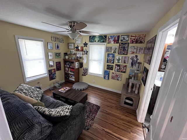 201 W Waid Ave, Muncie, IN 47303 - living area featuring healthy amount of natural light, wood finished floors, a ceiling fan, and baseboards