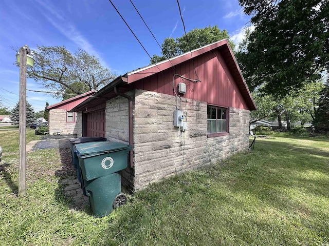 201 W Waid Ave, Muncie, IN 47303 - view of home's exterior with stone siding and a lawn