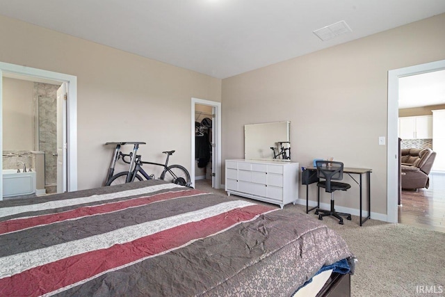3102 Paradise Cir, Newburgh, IN 47630 - carpeted bedroom with baseboards, a spacious closet, connected bathroom, and an office area