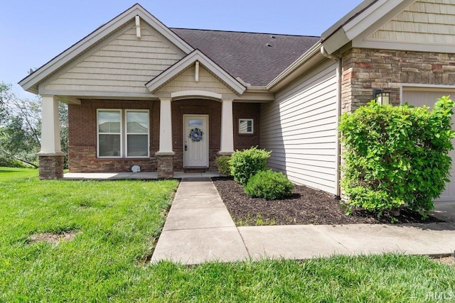 3102 Paradise Cir, Newburgh, IN 47630 - craftsman inspired home featuring a porch, a front lawn, stone siding, brick siding, and a shingled roof
