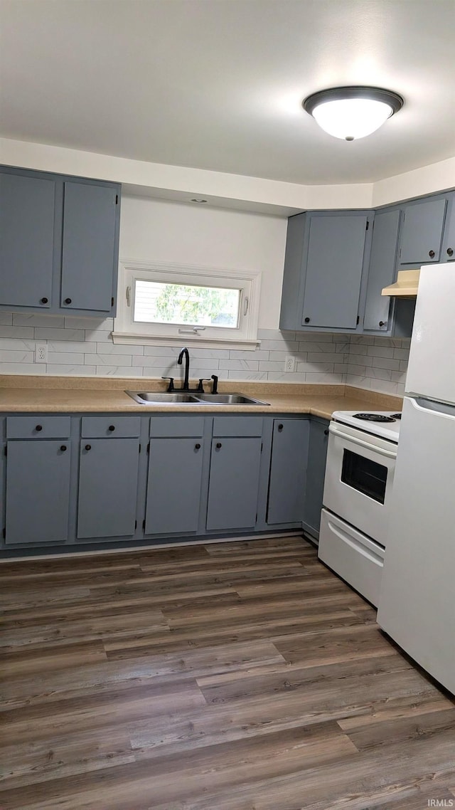1720 W 10th St, Marion, IN 46953 - kitchen with white appliances, a sink, gray cabinets, tasteful backsplash, and dark wood-style flooring