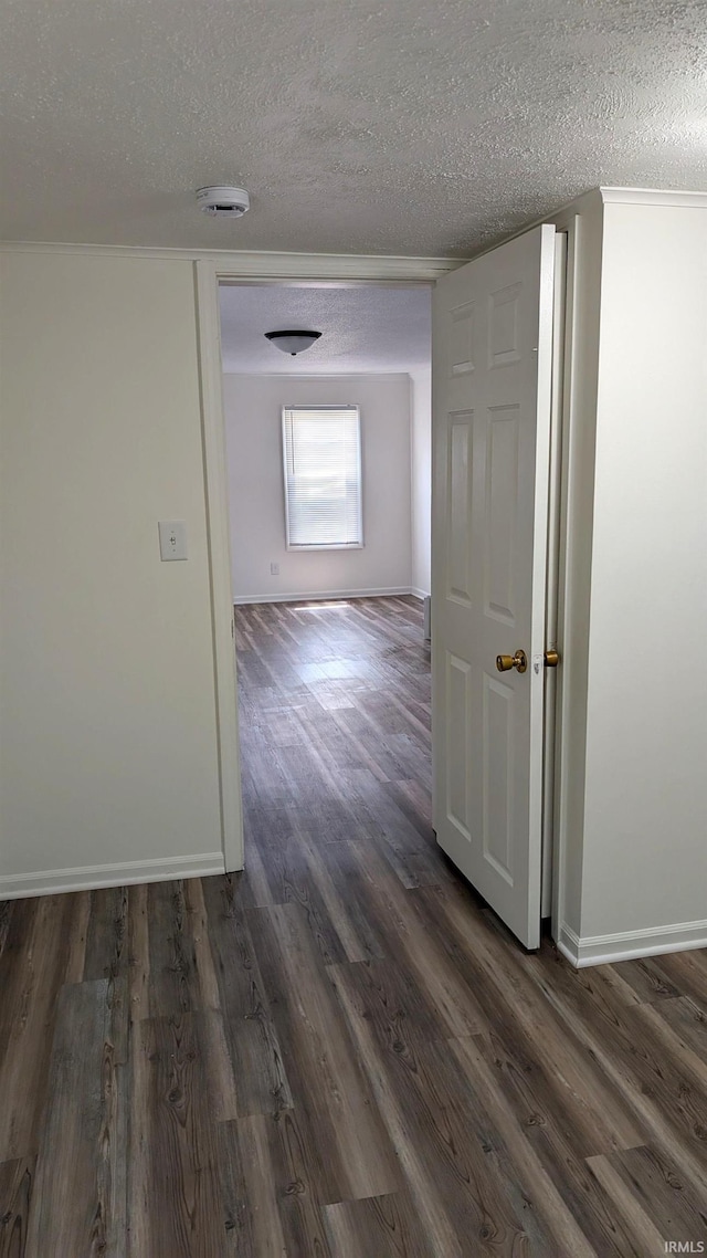 1720 W 10th St, Marion, IN 46953 - corridor featuring a textured ceiling, wood finished floors, and baseboards