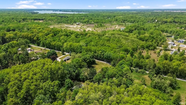aerial view of a heavily wooded area and a large body of water