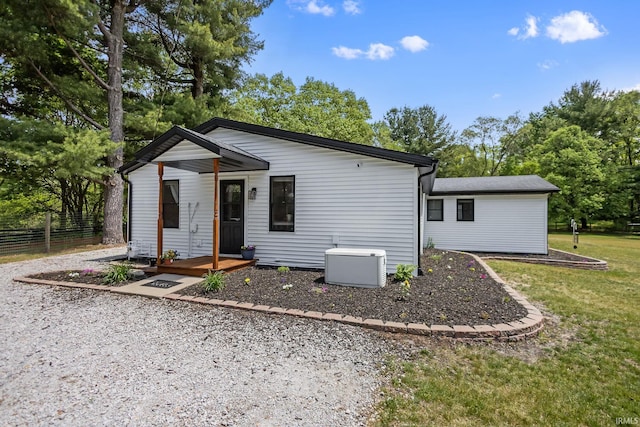 single story home featuring view of wooded area