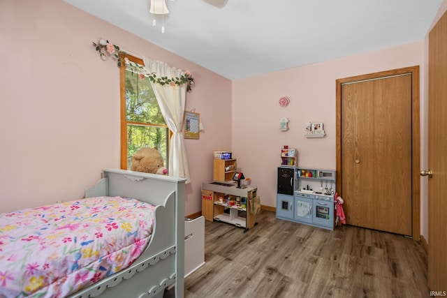 bedroom with wood finished floors and ceiling fan