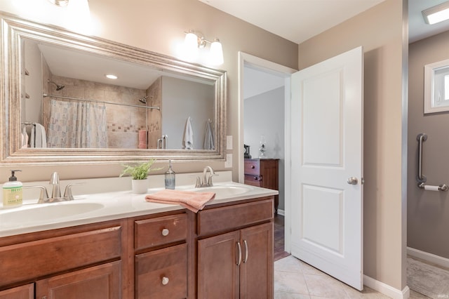 2108 Longway Ct, Evansville, IN 47711 - bathroom with double vanity, a tile shower, and tile patterned flooring