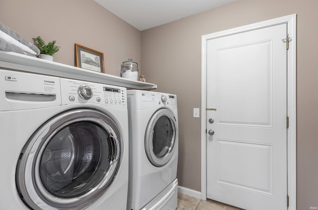 2108 Longway Ct, Evansville, IN 47711 - washroom with washing machine and clothes dryer, baseboards, and light tile patterned floors