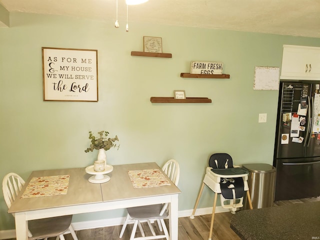 301 Raleigh Rd, Galveston, IN 46932 - dining area featuring wood finished floors and baseboards