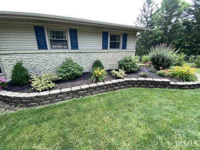 205 Holly Ln, Geneva, IN 46740 - view of property exterior with a lawn