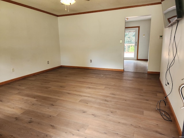 205 Holly Ln, Geneva, IN 46740 - empty room with ornamental molding, hardwood / wood-style floors, baseboards, and ceiling fan